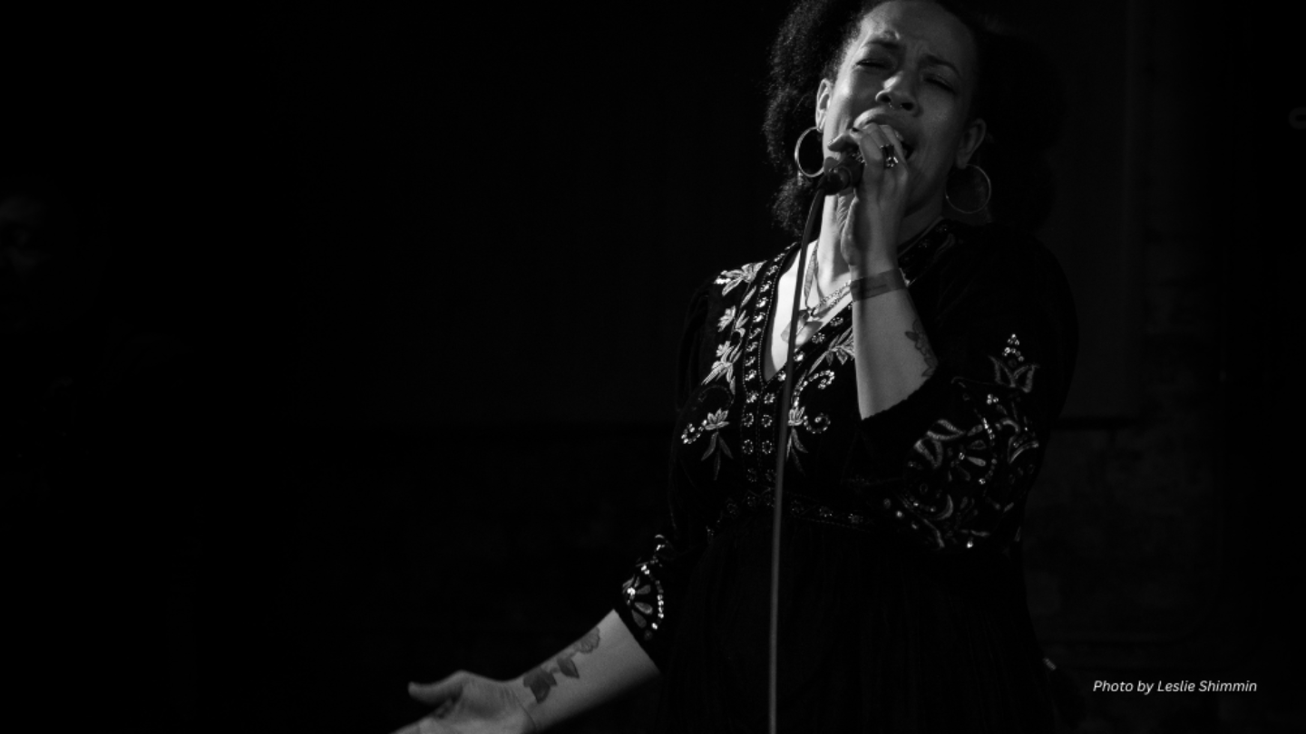 Black and white photo of someone singing